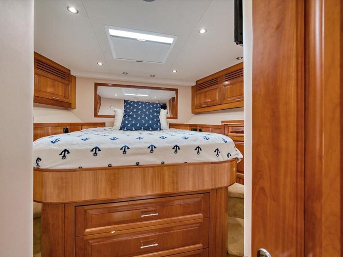 a bedroom with a large bed aboard EVA VII Yacht for Sale