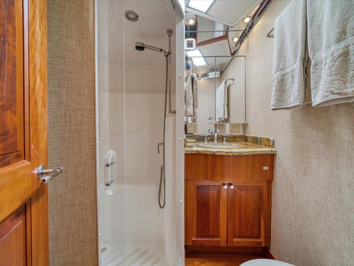 a bathroom with a shower and sink aboard EVA VII Yacht for Sale