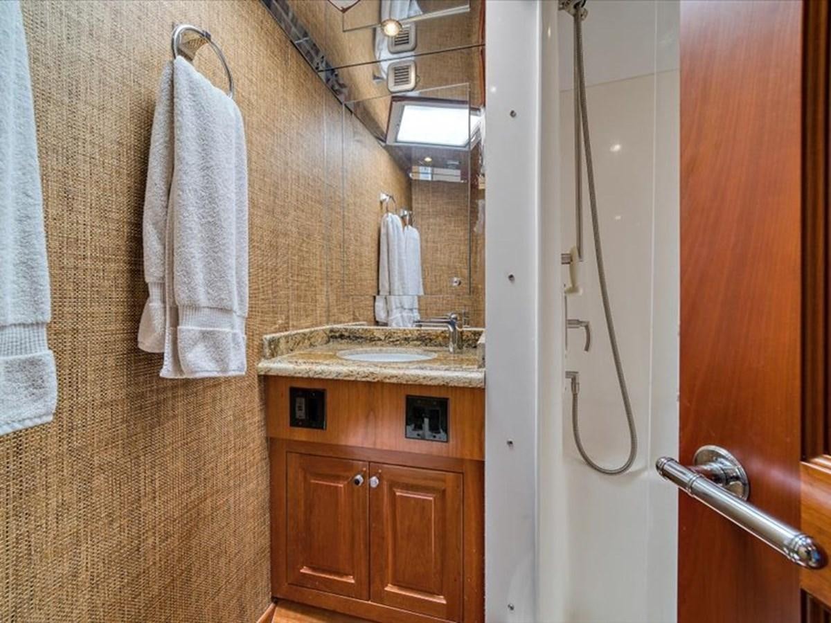 a bathroom with a sink and a mirror aboard EVA VII Yacht for Sale