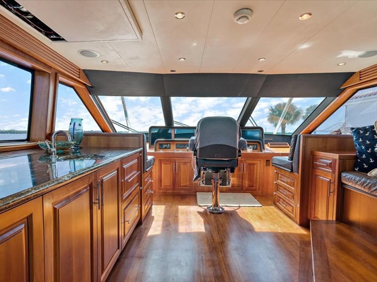 a large kitchen with a large window aboard EVA VII Yacht for Sale