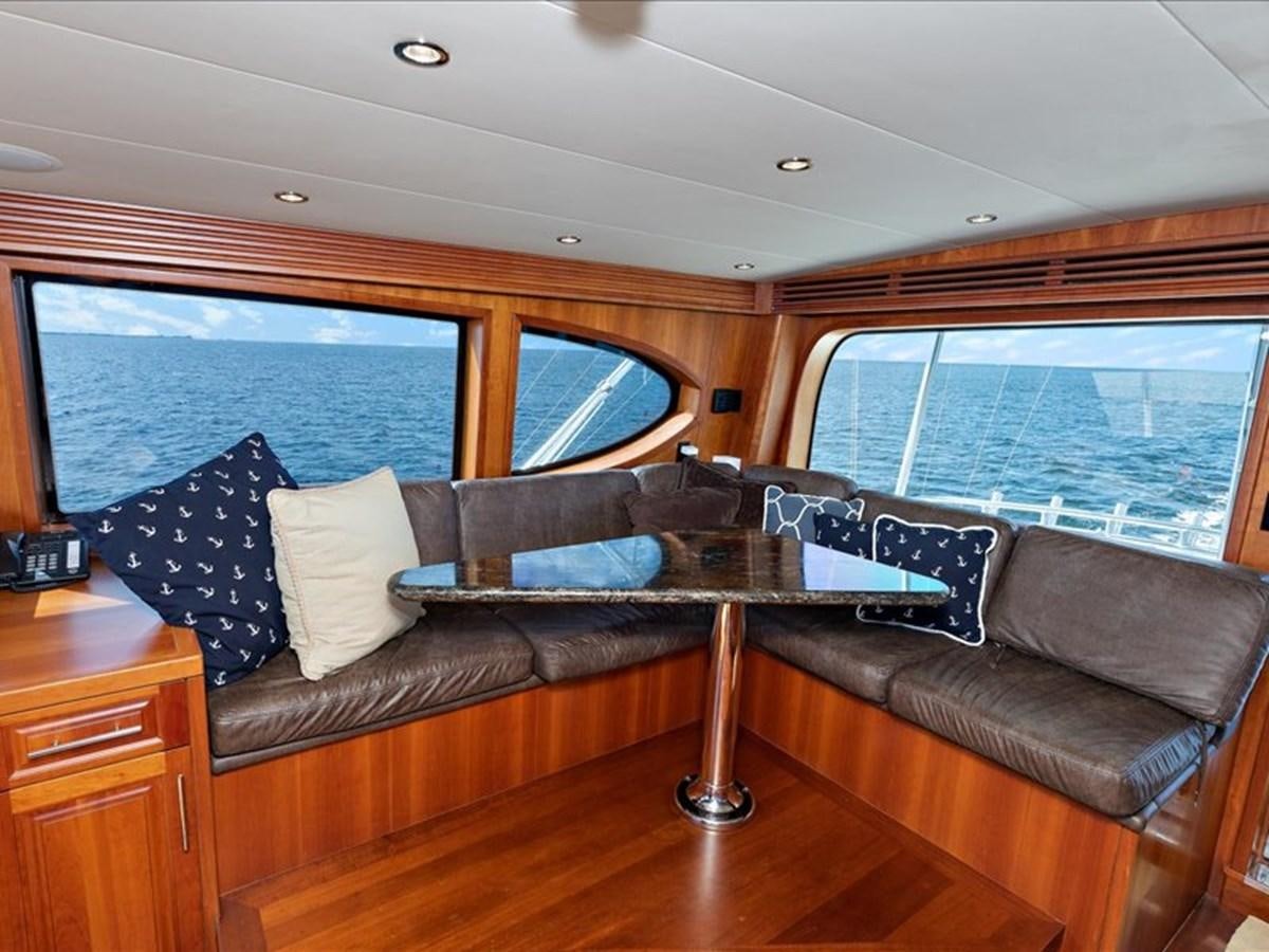 a leather couch in a room aboard EVA VII Yacht for Sale
