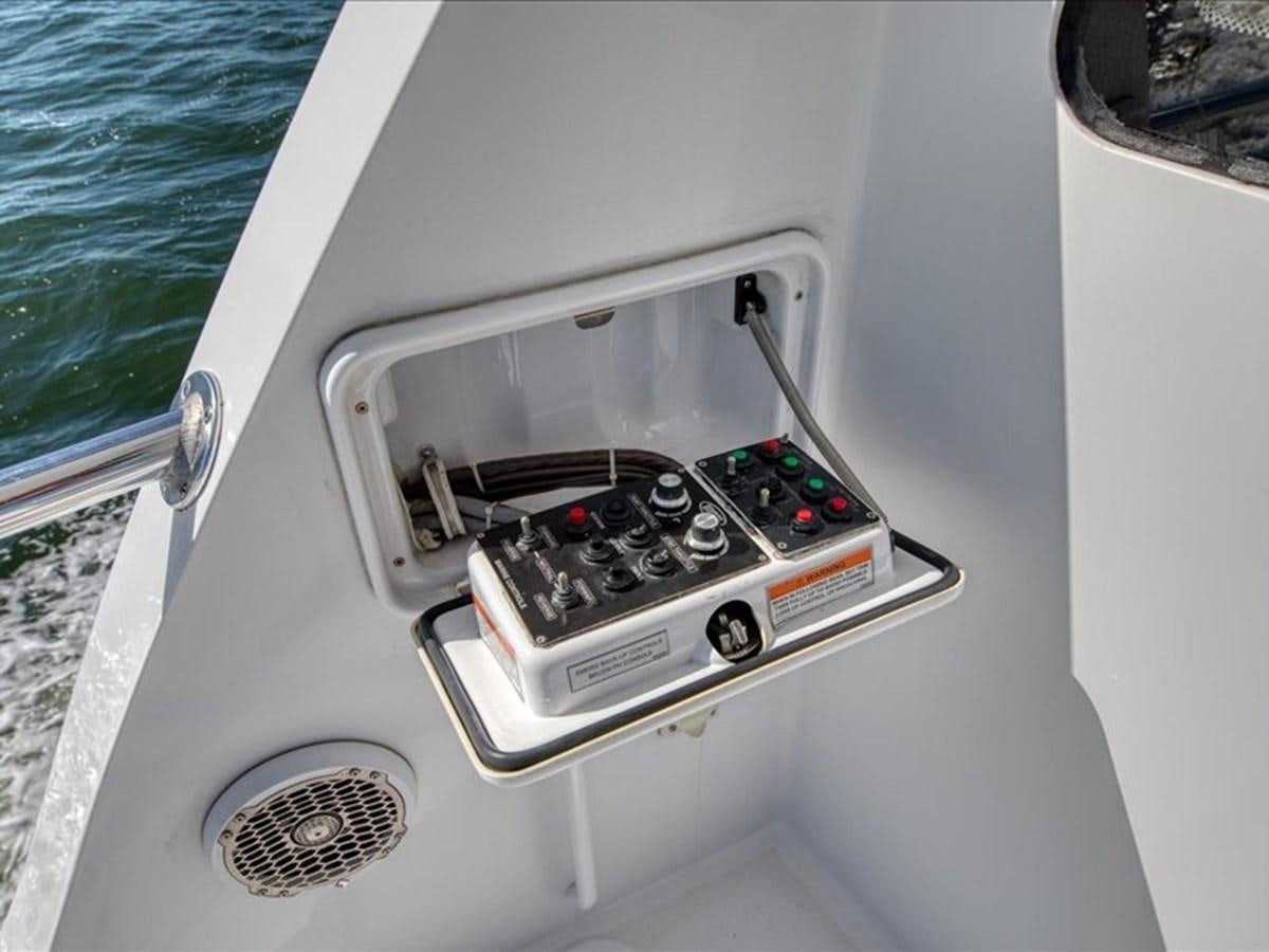 a white car with a remote control aboard EVA VII Yacht for Sale