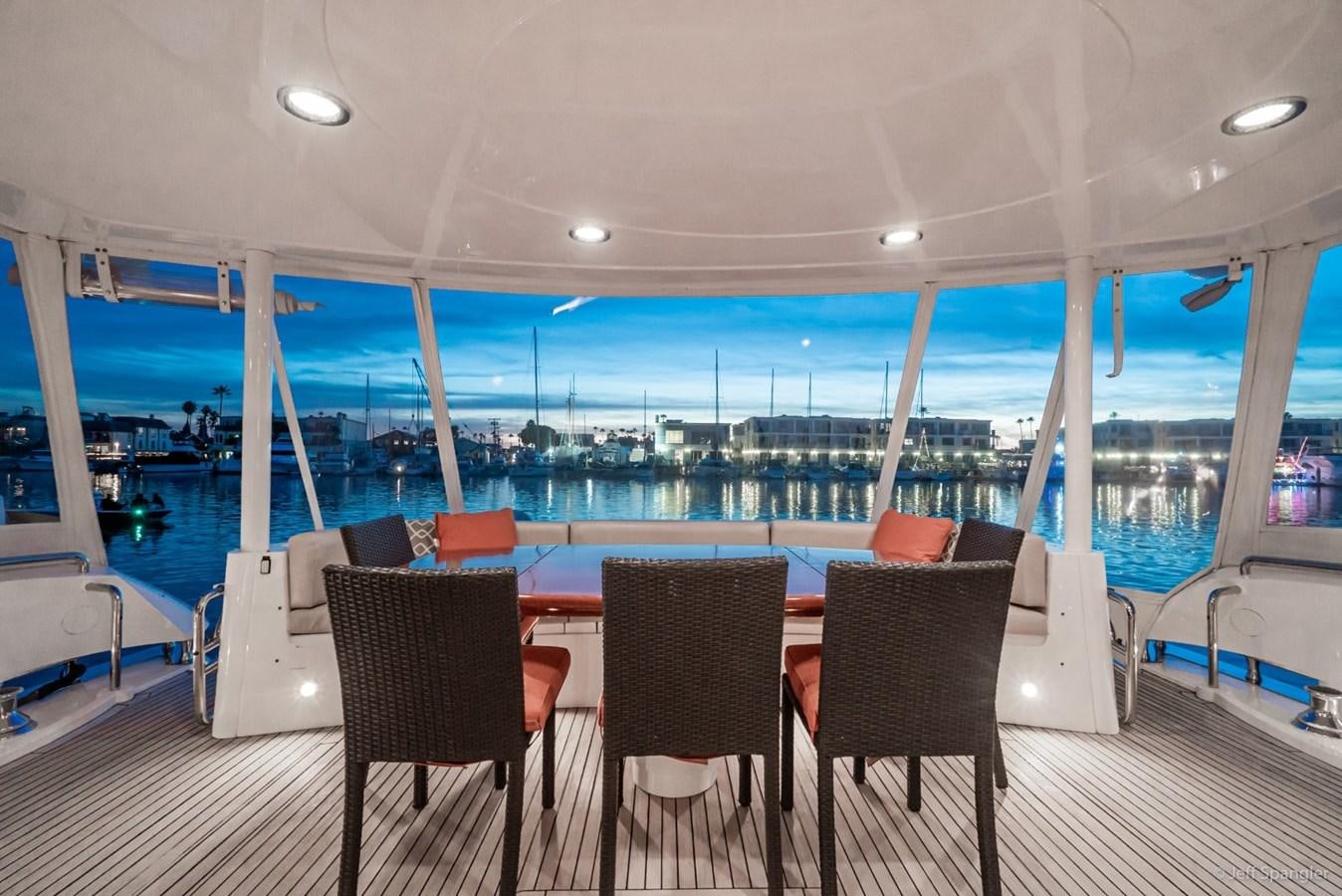a boat with a table and chairs aboard NAKOA Yacht for Sale