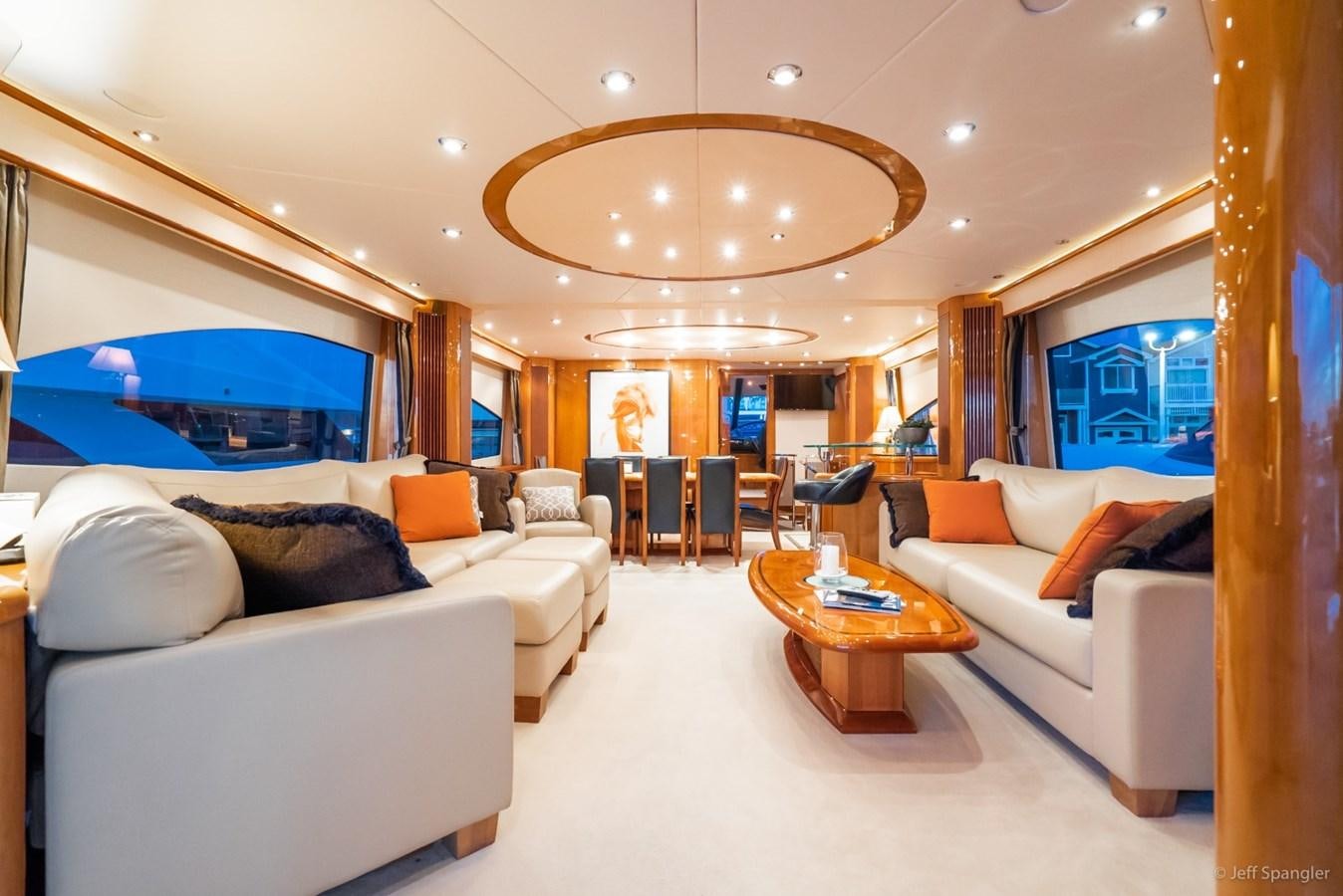 a living room with a large mirror aboard NAKOA Yacht for Sale