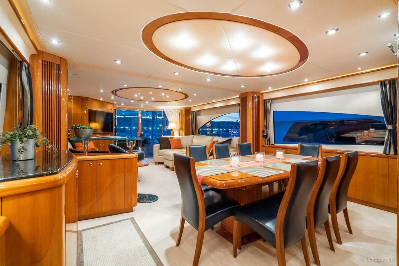 a room with a table and chairs aboard NAKOA Yacht for Sale