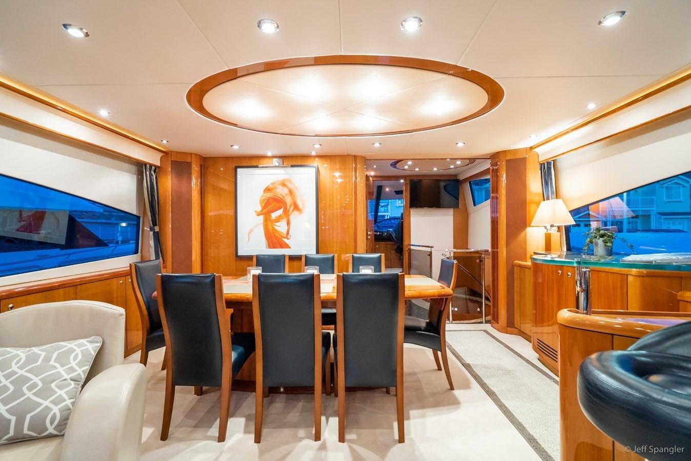 a room with a table and chairs aboard NAKOA Yacht for Sale