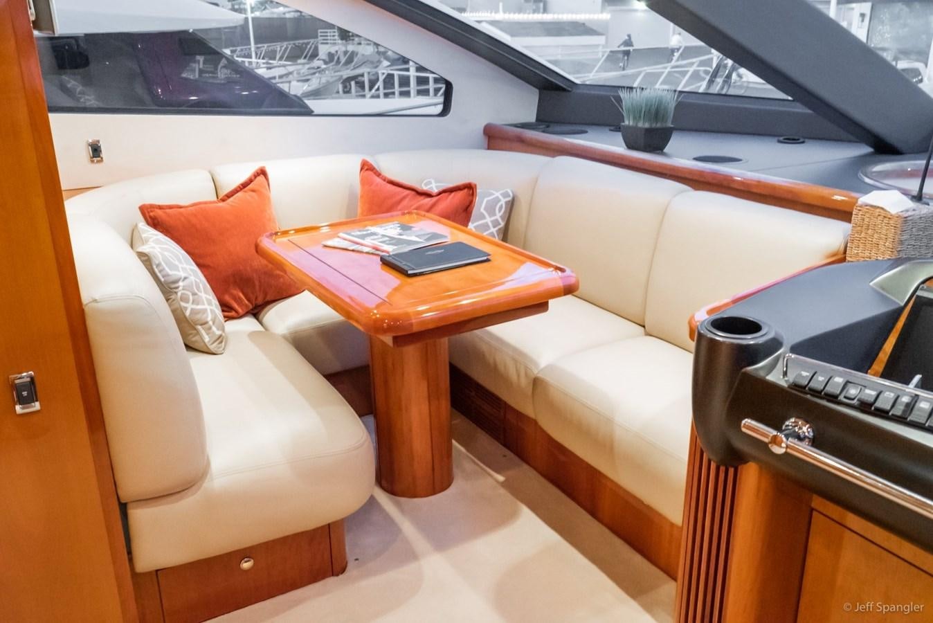 a living room with a couch and a table aboard NAKOA Yacht for Sale