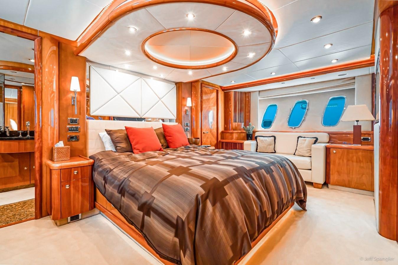 a large bedroom with a large bed aboard NAKOA Yacht for Sale