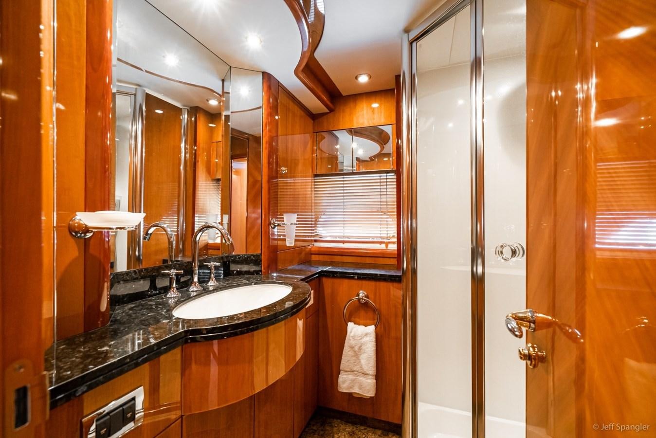 a bathroom with a sink and a shower aboard NAKOA Yacht for Sale