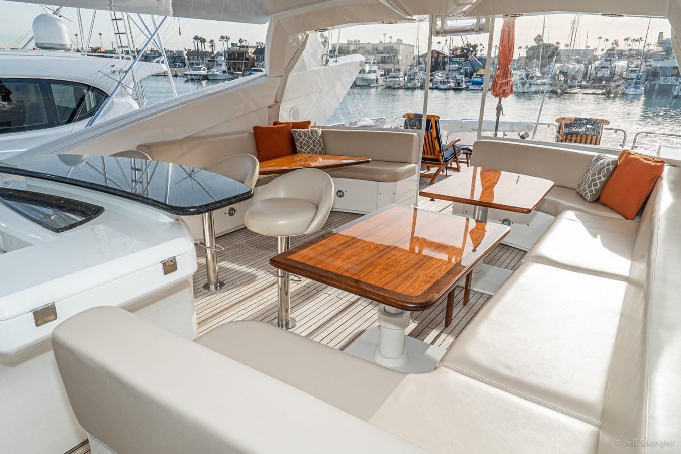 a boat with a table and chairs aboard NAKOA Yacht for Sale