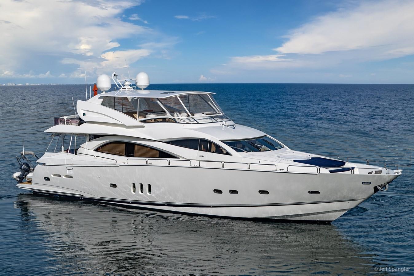 a white yacht in the water aboard NAKOA Yacht for Sale