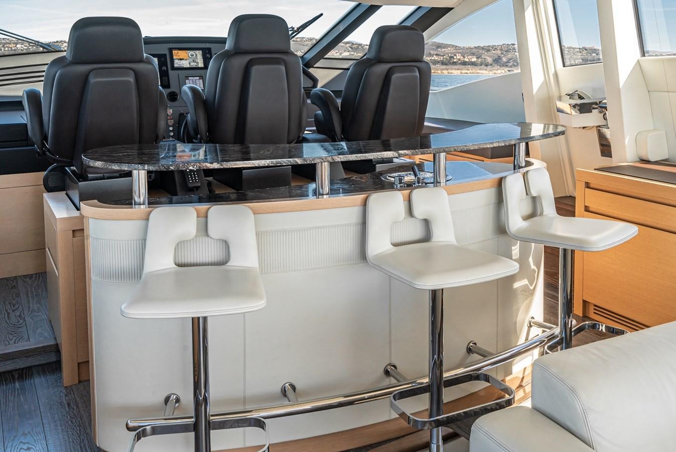 a table with chairs and a desk aboard MO T0WN Yacht for Sale