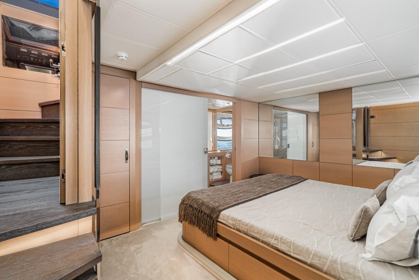 a bedroom with a bed and a television aboard MO T0WN Yacht for Sale