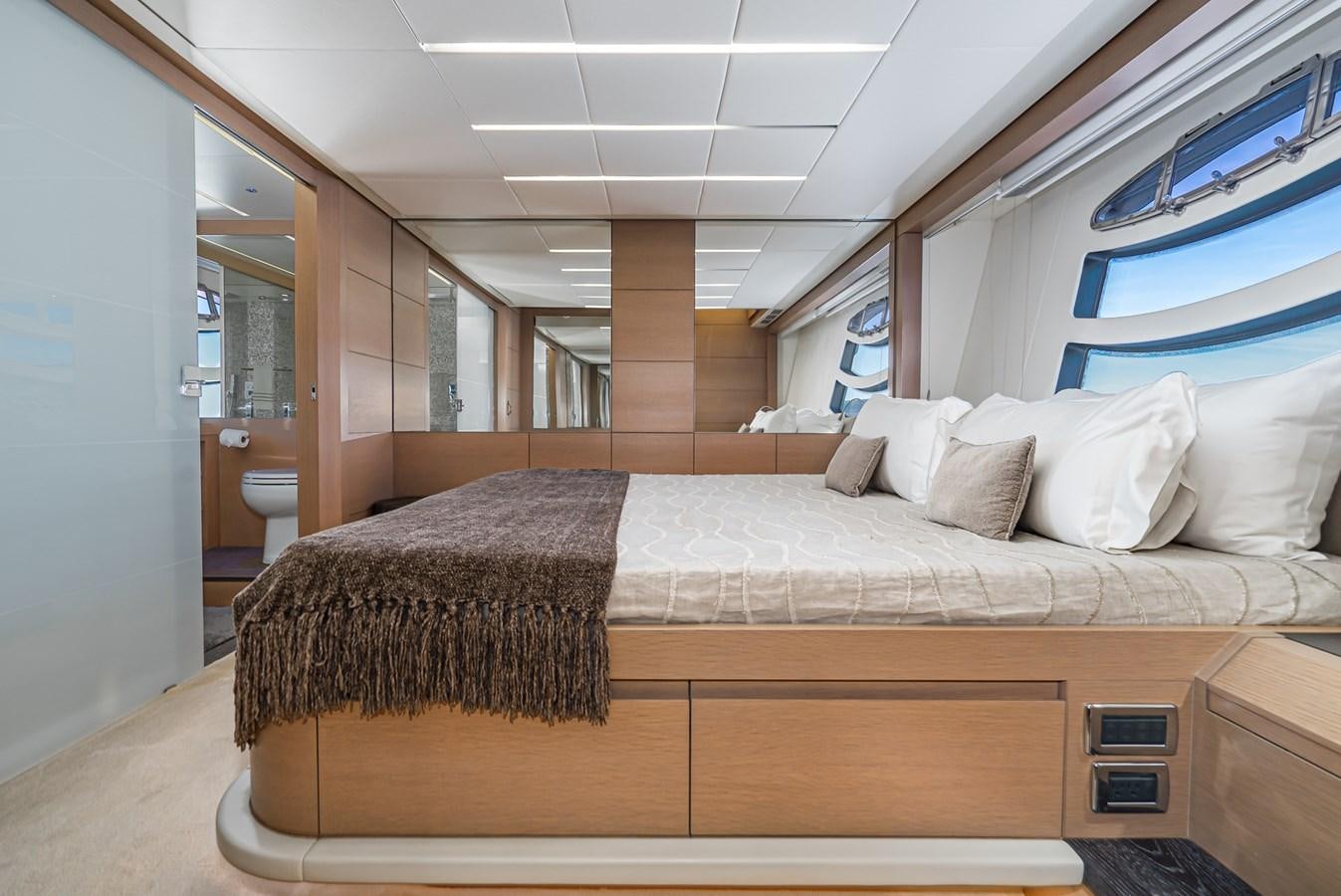a bed in a room aboard MO T0WN Yacht for Sale