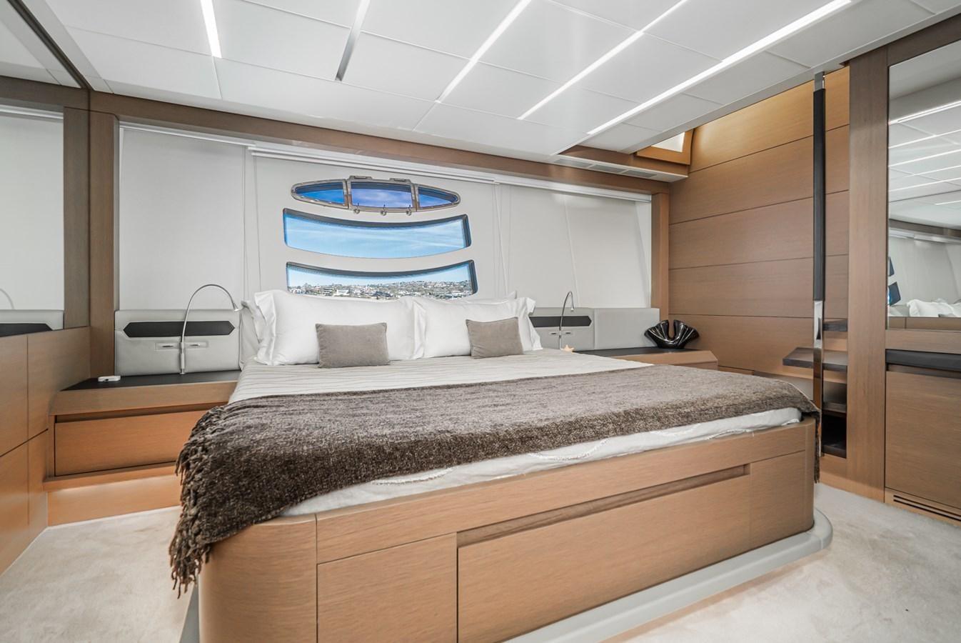 a bed with a large bed aboard MO T0WN Yacht for Sale