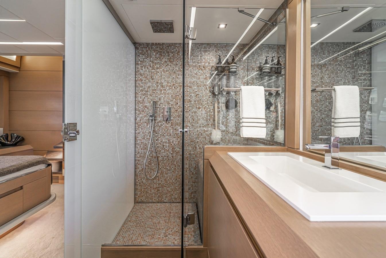 a bathroom with a shower and sink aboard MO T0WN Yacht for Sale
