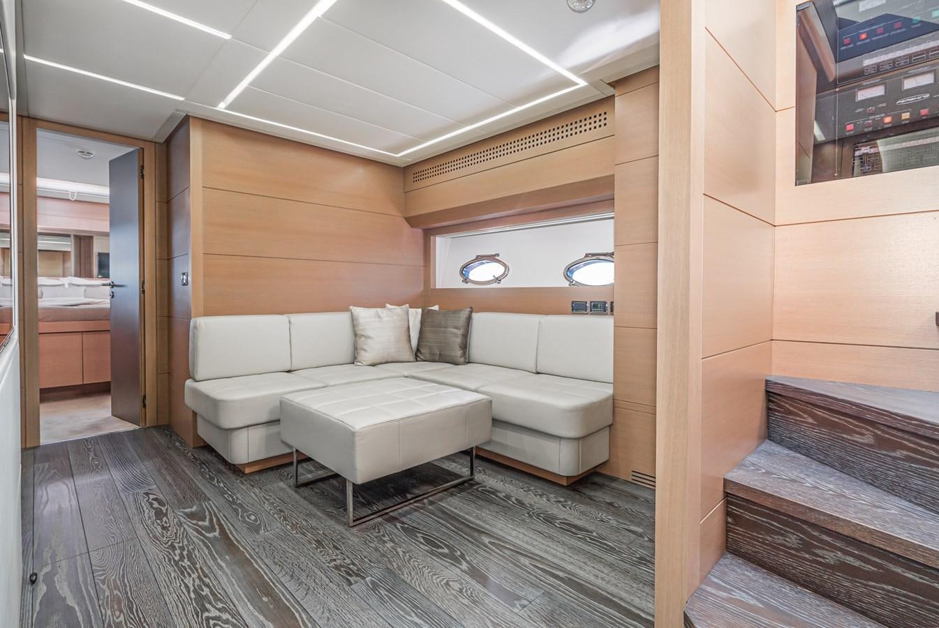 a living room with a couch aboard MO T0WN Yacht for Sale