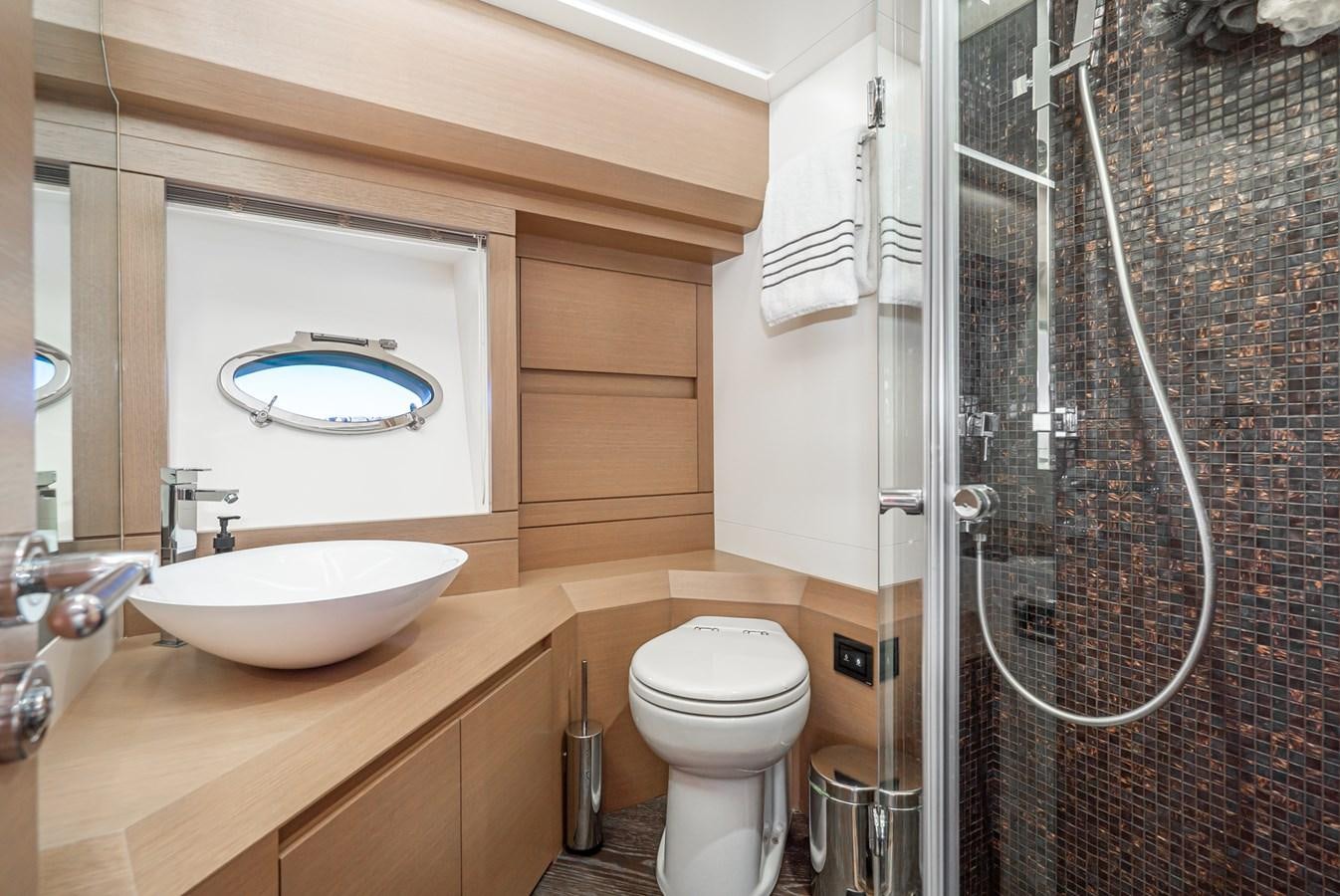 a bathroom with a sink and toilet aboard MO T0WN Yacht for Sale