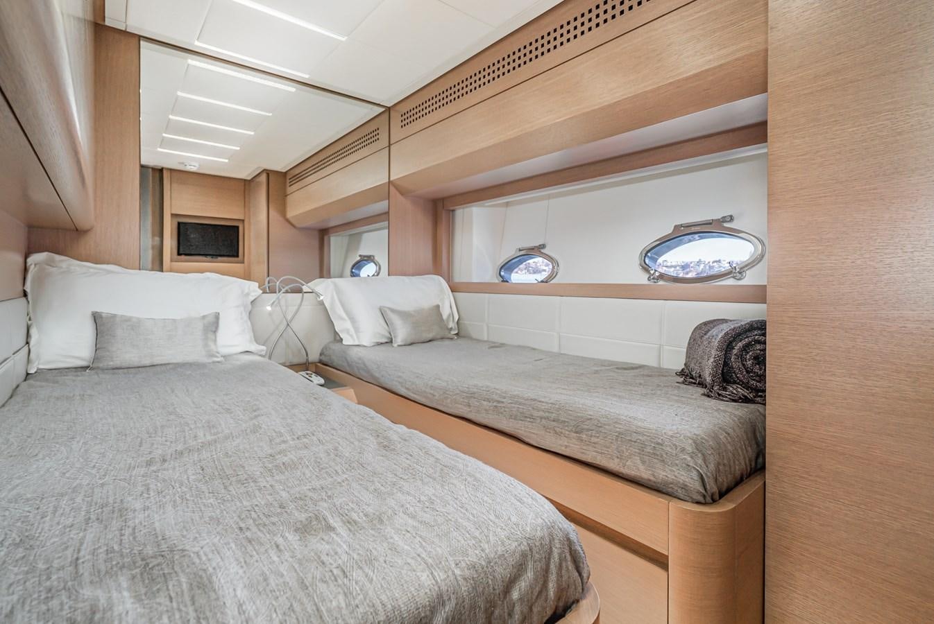 a bedroom with a bed and a couch aboard MO T0WN Yacht for Sale