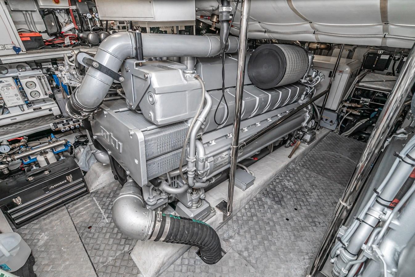 a car with a large engine aboard MO T0WN Yacht for Sale