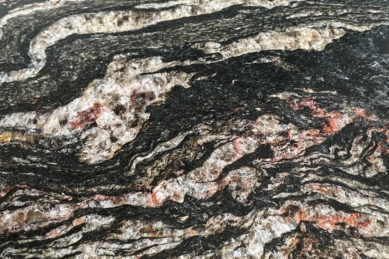 a rocky landscape with water aboard MO T0WN Yacht for Sale