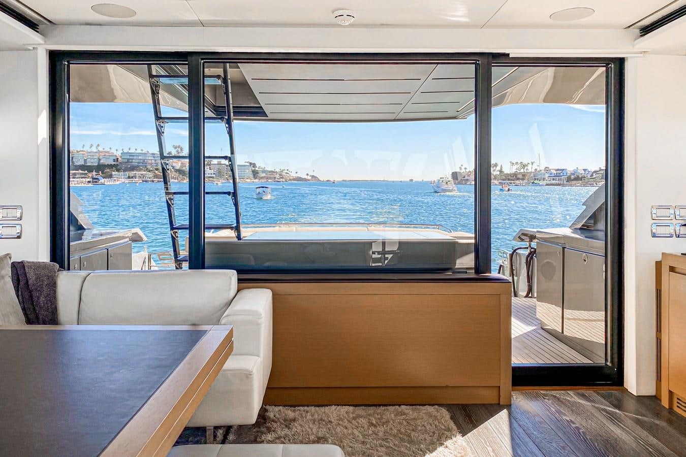 a room with a view of the ocean and a large window aboard MO T0WN Yacht for Sale