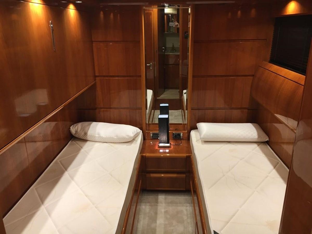 a room with a bed and a mirror aboard YAIZA T Yacht for Sale