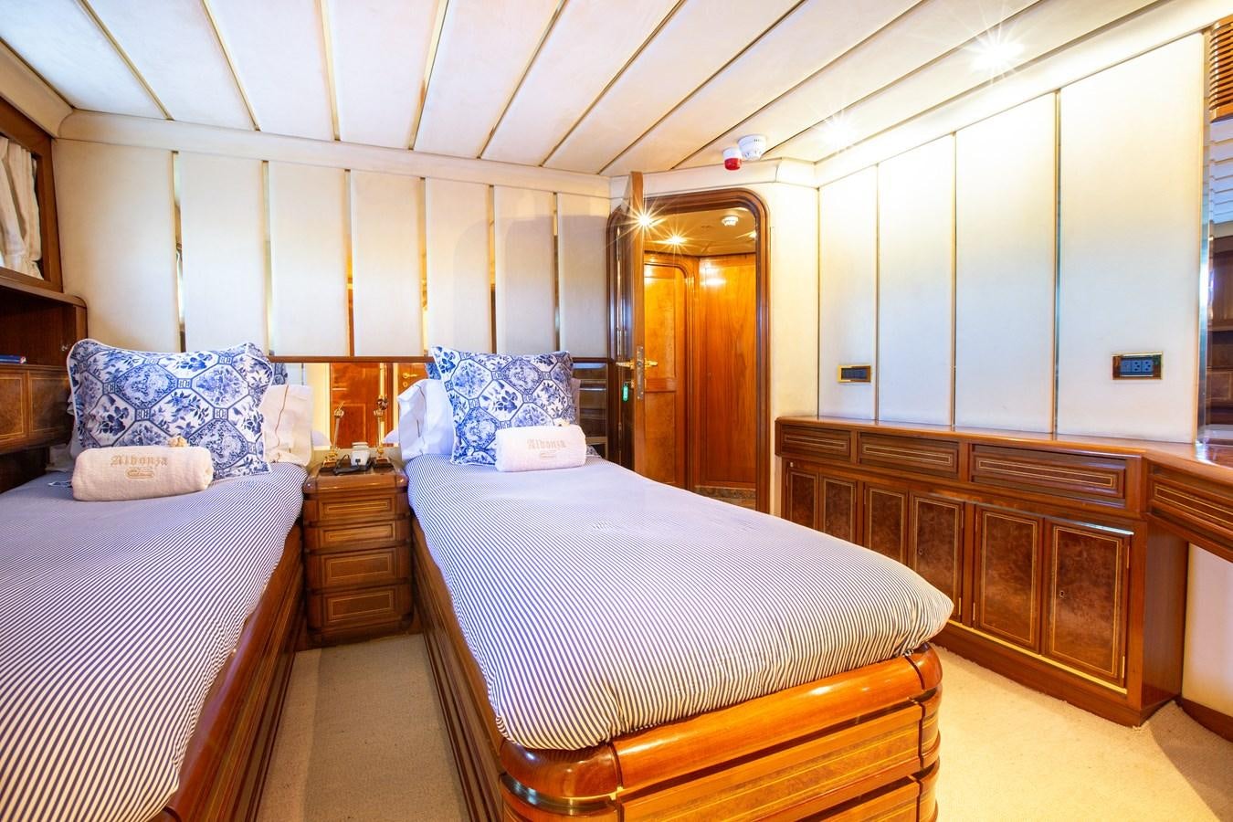 a room with a bed and a mirror aboard ALDONZA Yacht for Sale