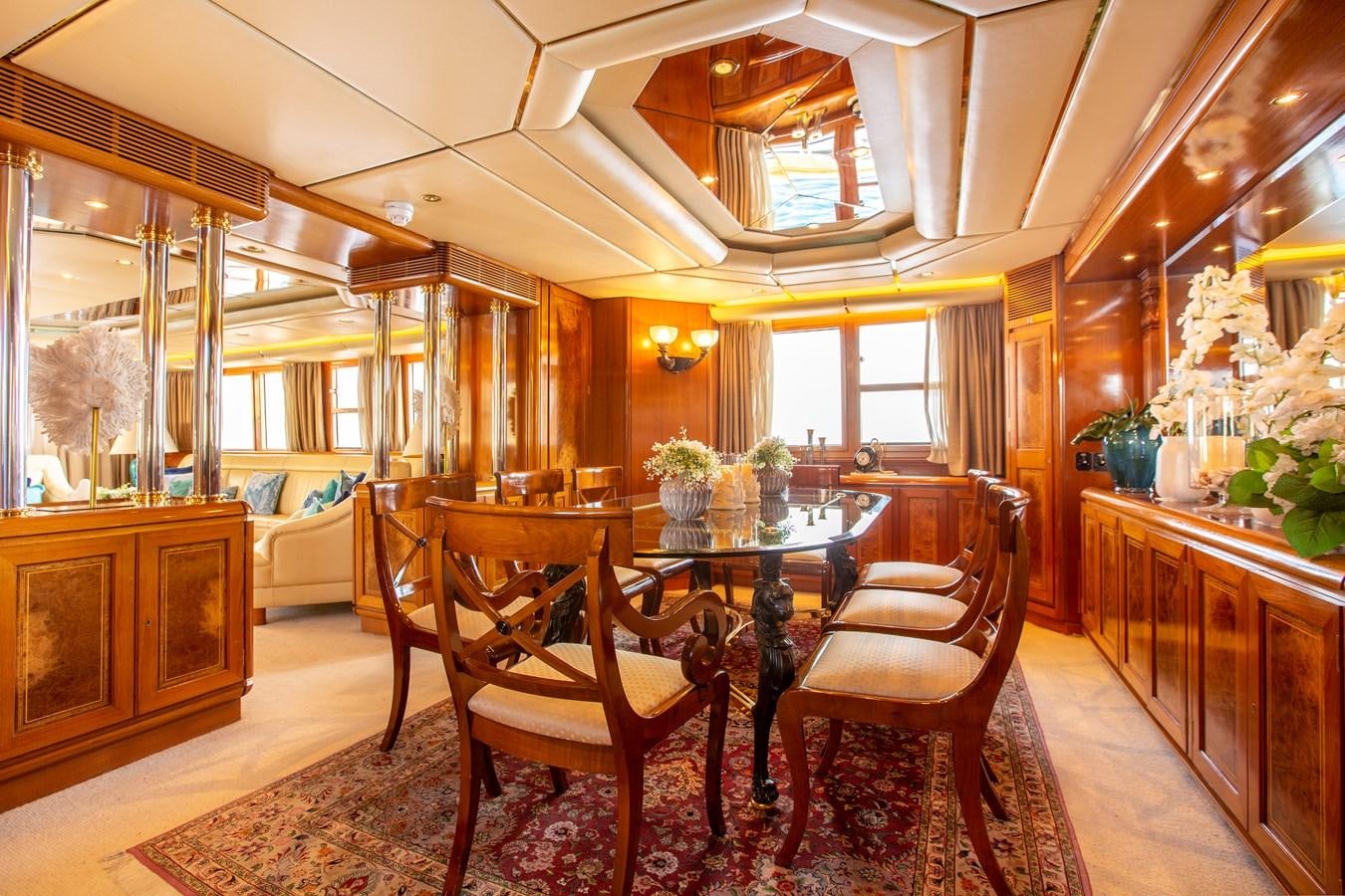 a dining room with a table and chairs aboard ALDONZA Yacht for Sale