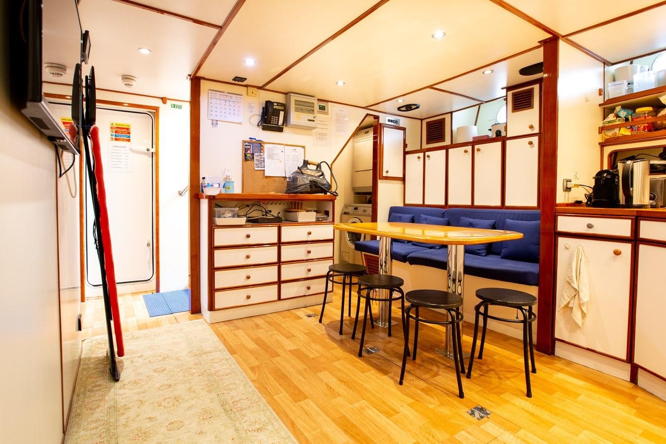 a room with a table and chairs aboard ALDONZA Yacht for Sale