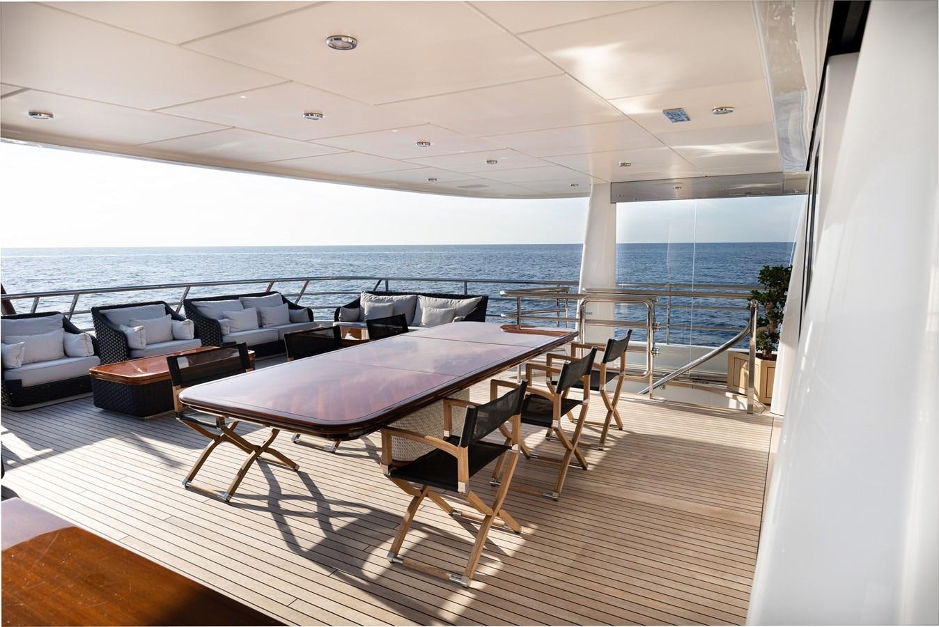 a room with a table and chairs aboard WERE DREAMS Yacht for Sale