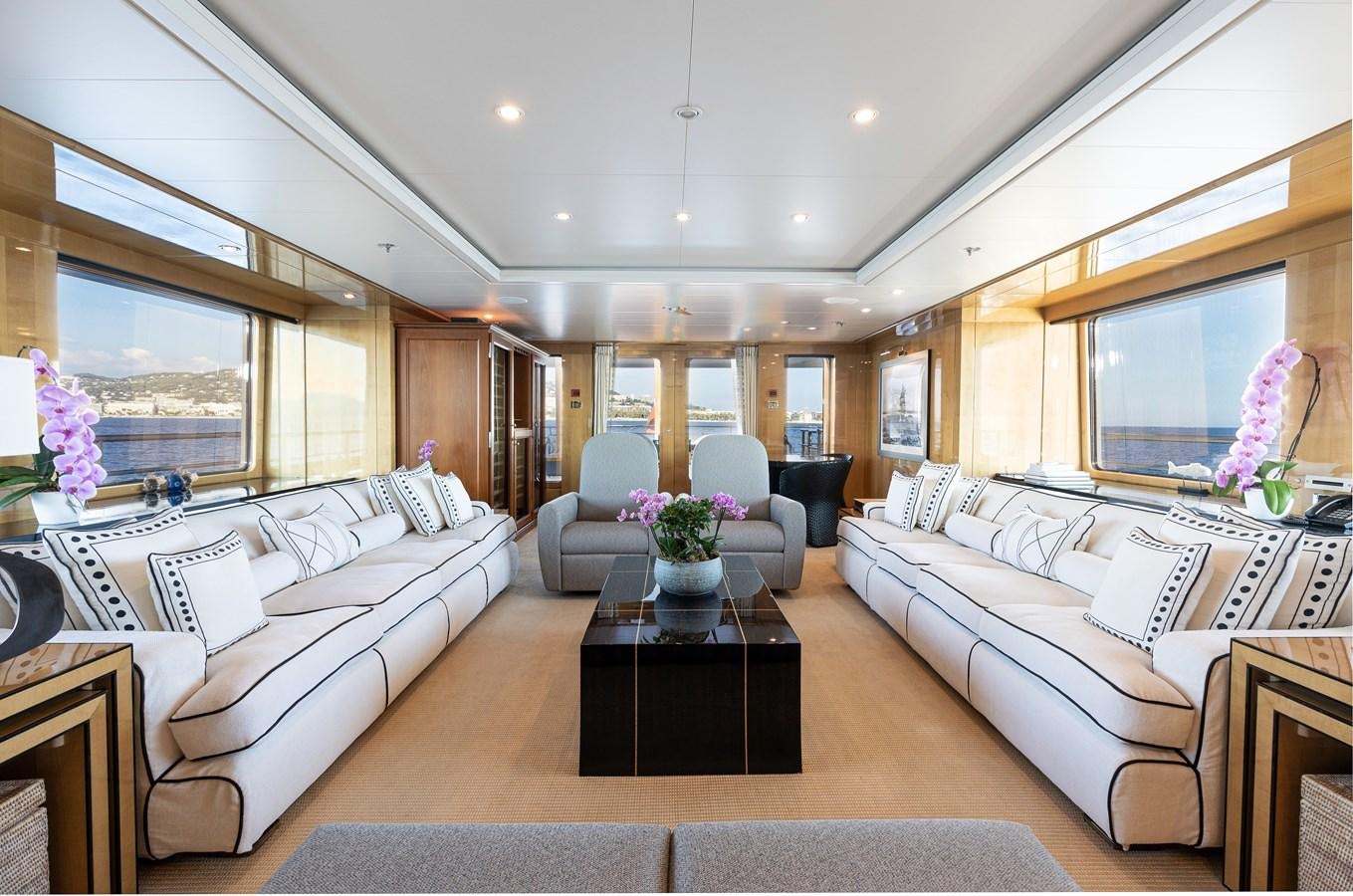 a living room with a large window aboard WERE DREAMS Yacht for Sale