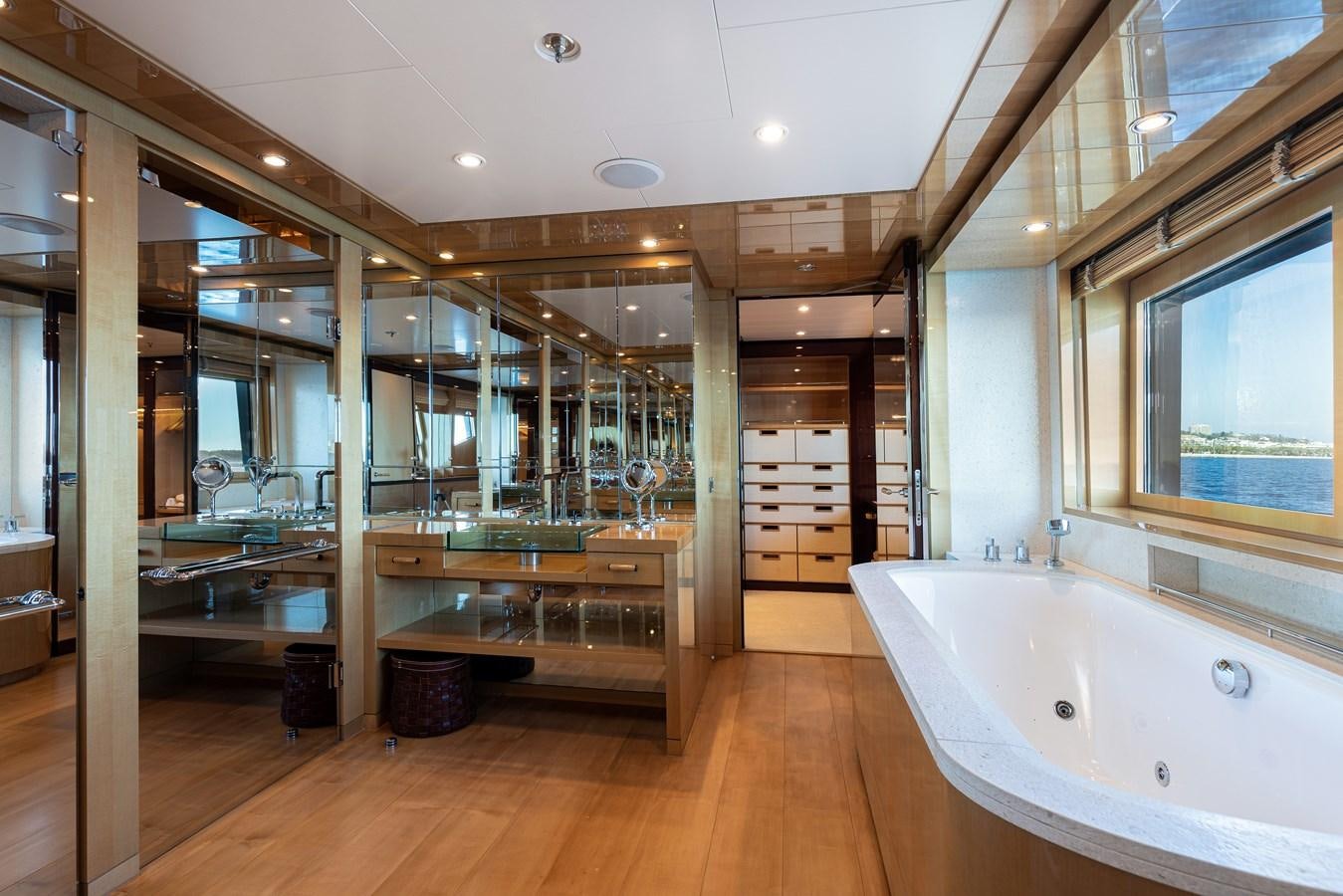 a large bathroom with a large tub aboard WERE DREAMS Yacht for Sale