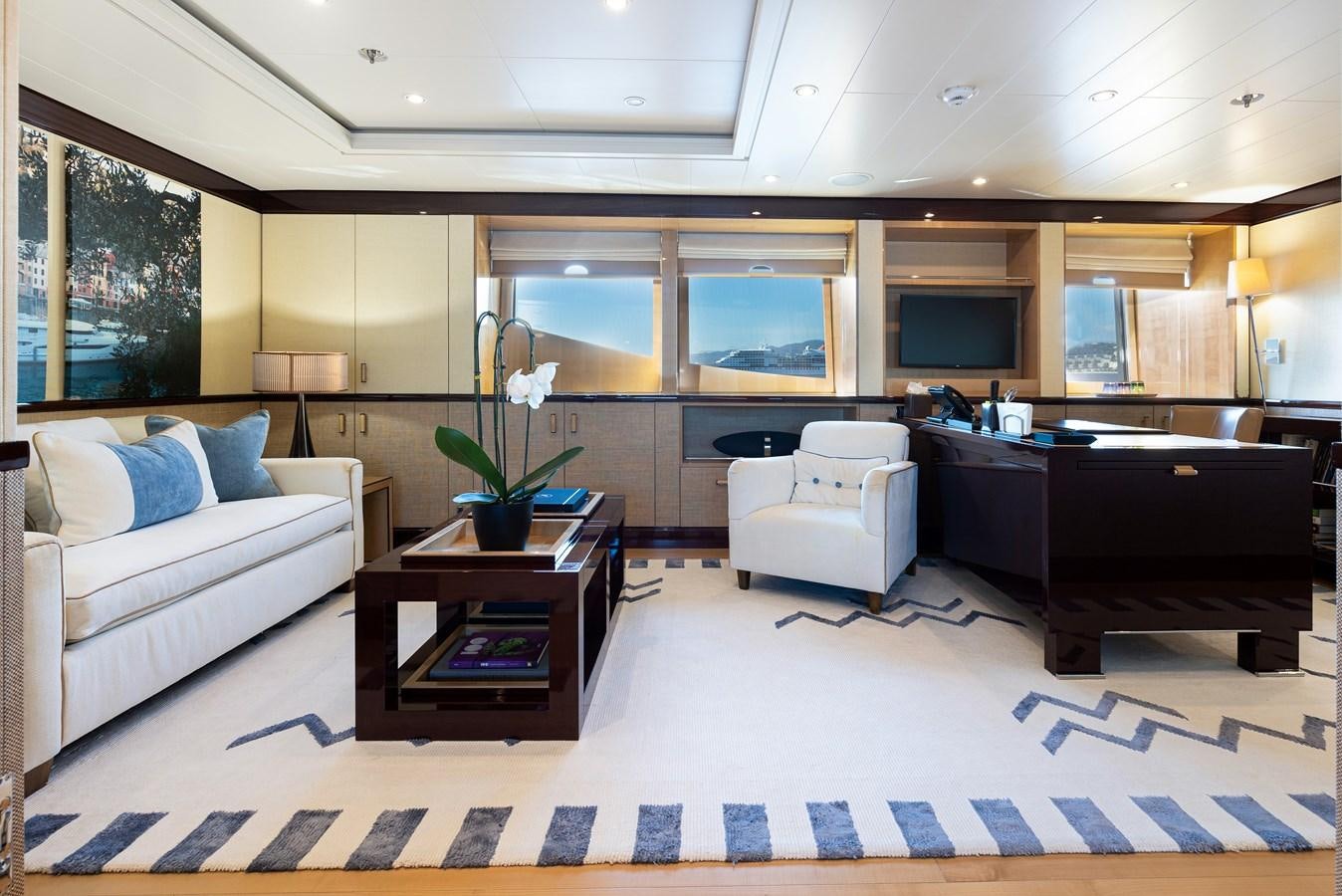 a living room with a piano and a piano aboard WERE DREAMS Yacht for Sale
