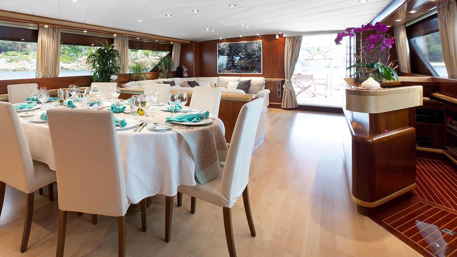 a large room with tables and chairs aboard SUNLINER X Yacht for Sale