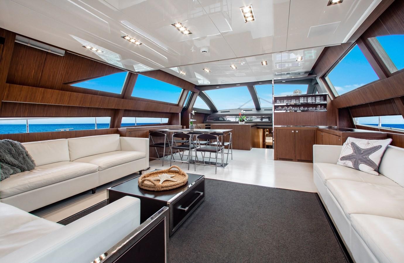 a room with a couch and a table aboard MOVIN DAY Yacht for Sale