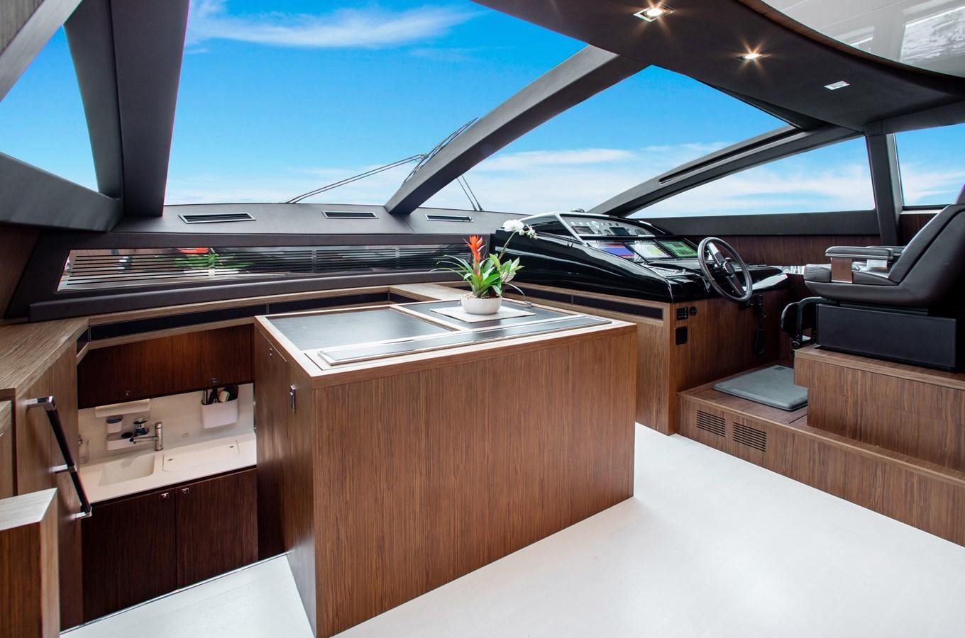 a room with a large window and a desk with a computer on it aboard MOVIN DAY Yacht for Sale