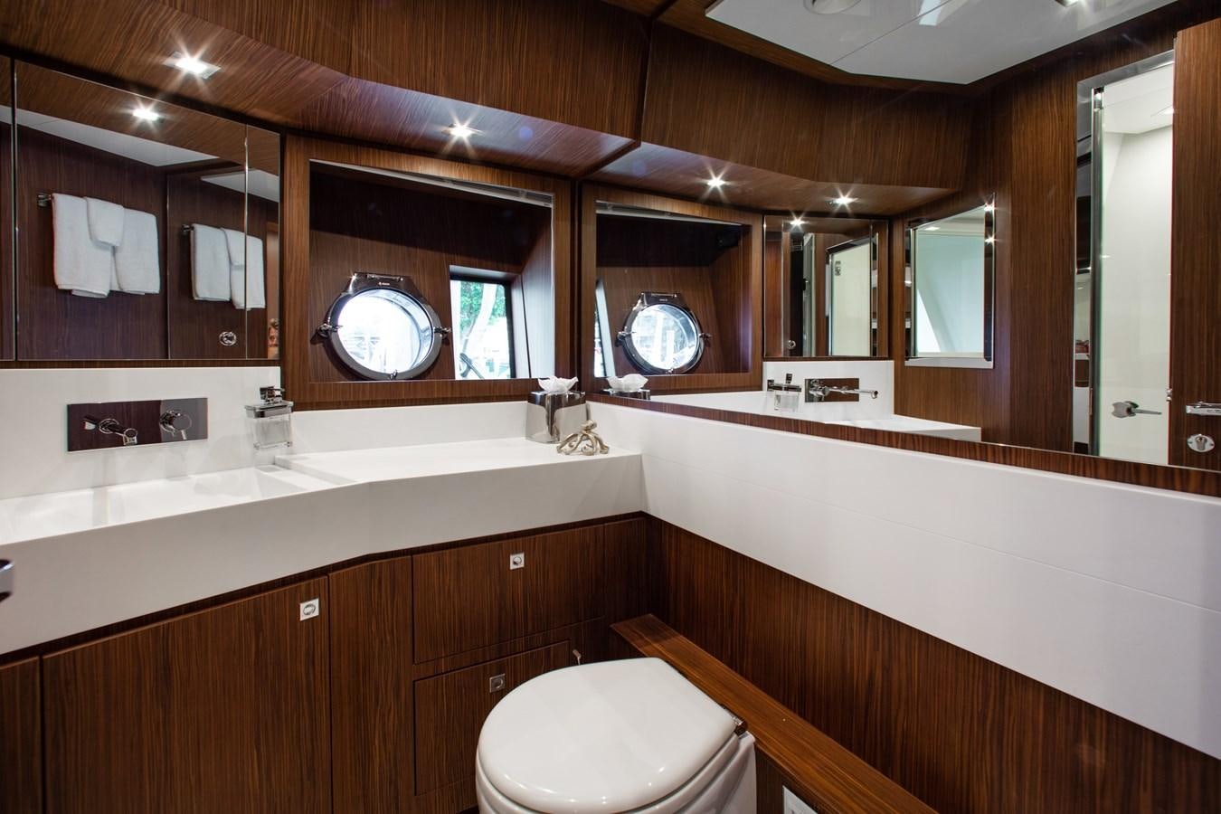 a bathroom with a large mirror aboard MOVIN DAY Yacht for Sale