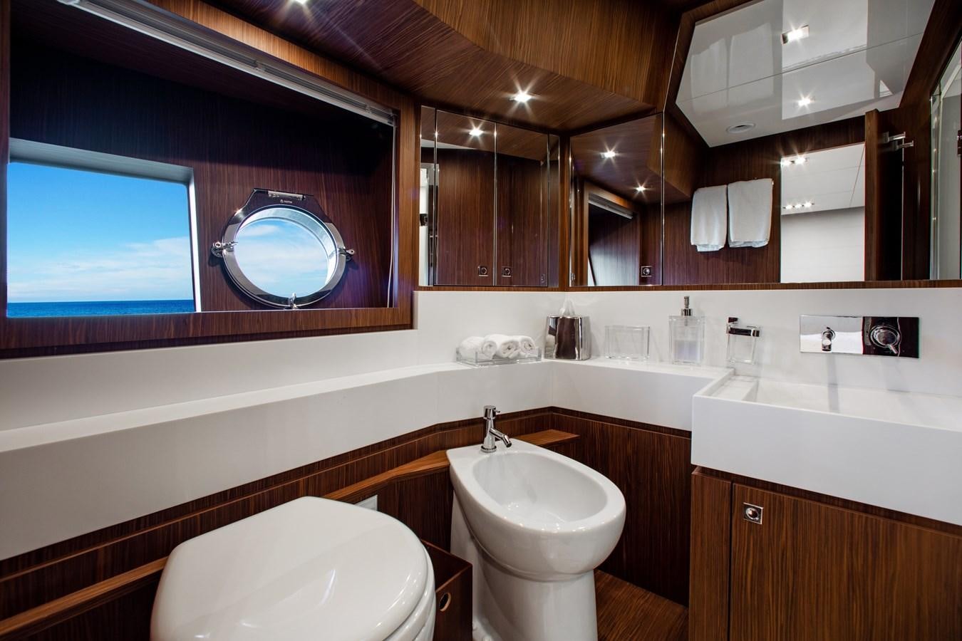 a bathroom with a large mirror aboard MOVIN DAY Yacht for Sale