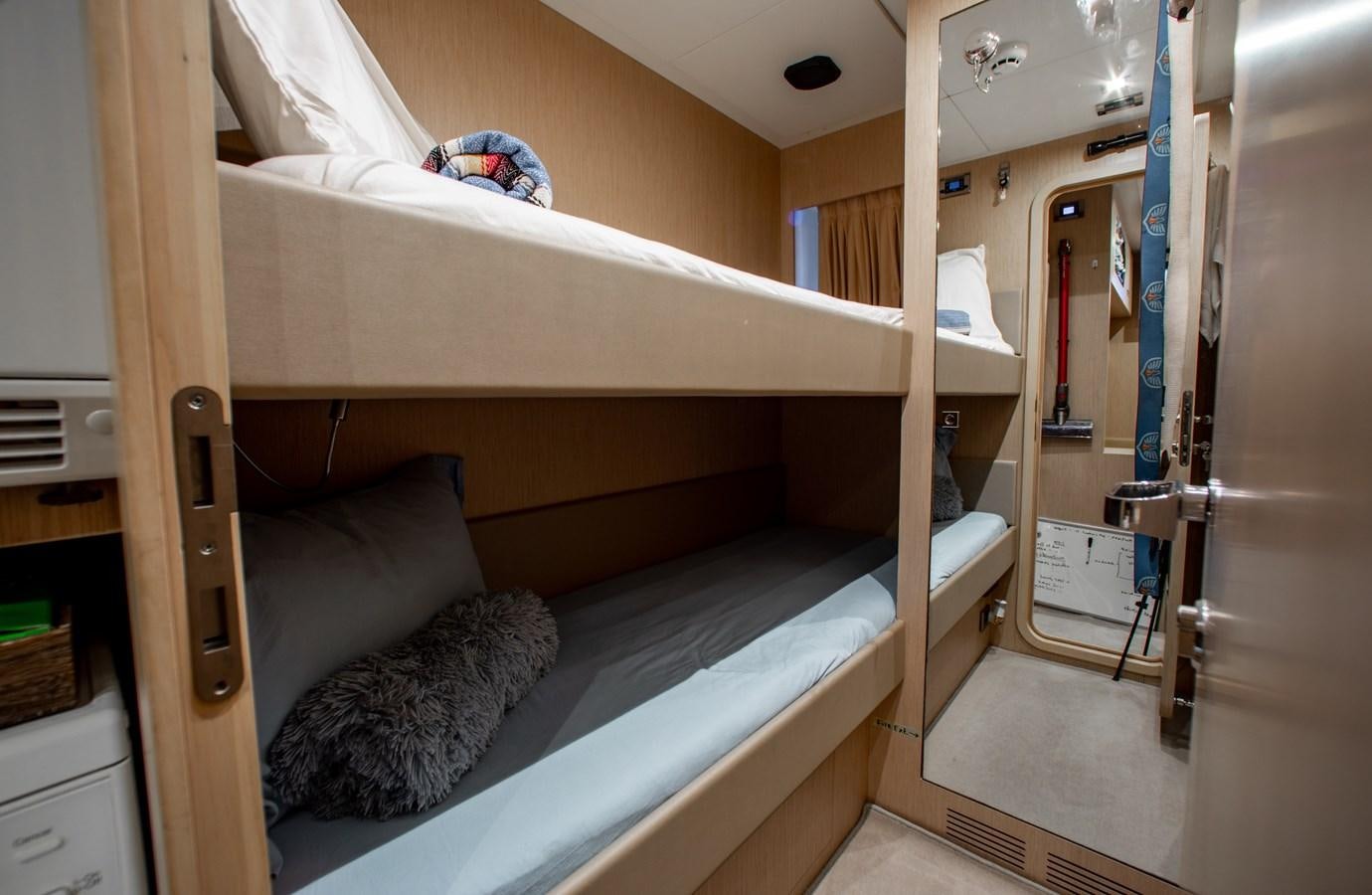 a small room with bunk beds aboard MOVIN DAY Yacht for Sale