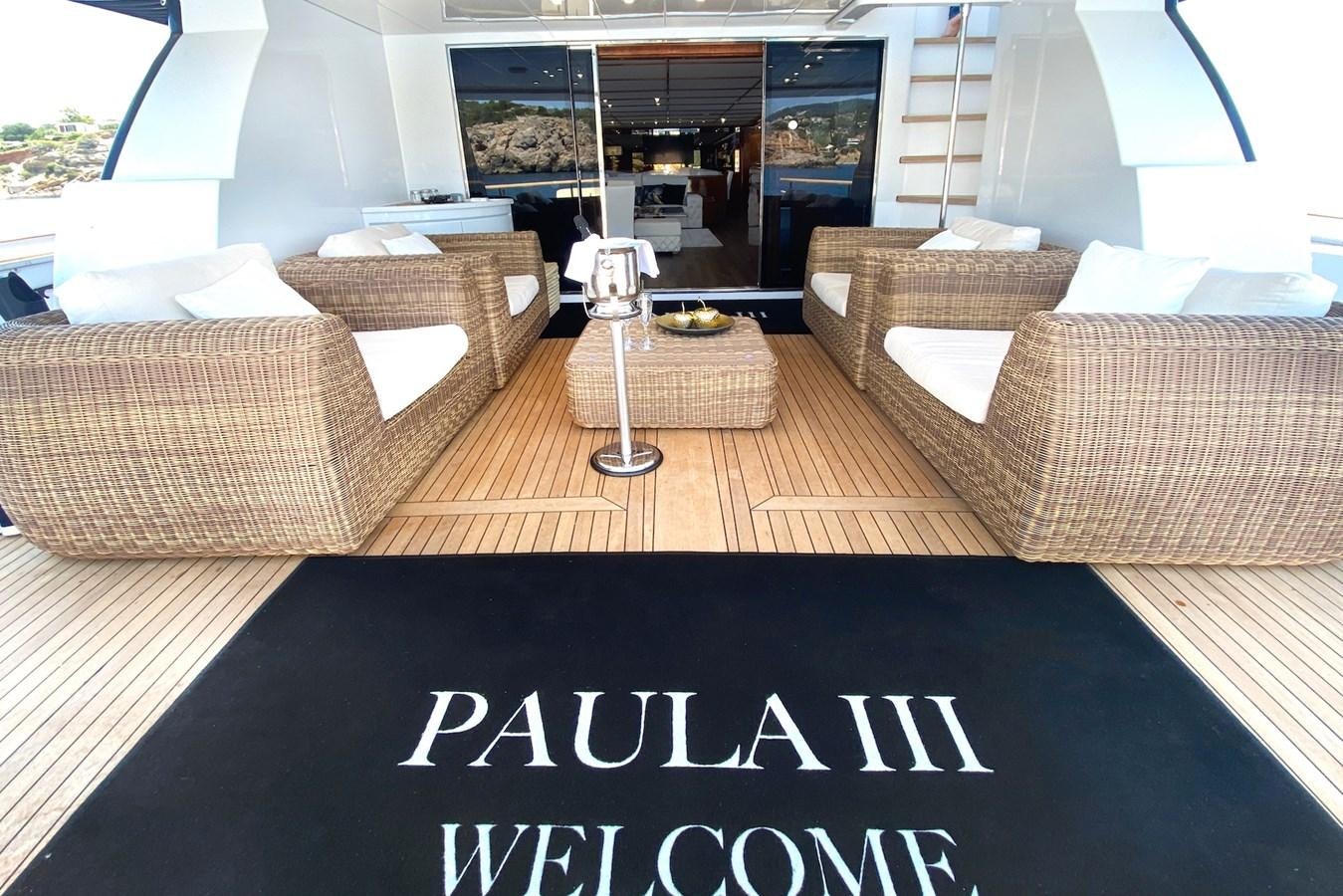 a living room with couches and a coffee table aboard PAULA III Yacht for Sale