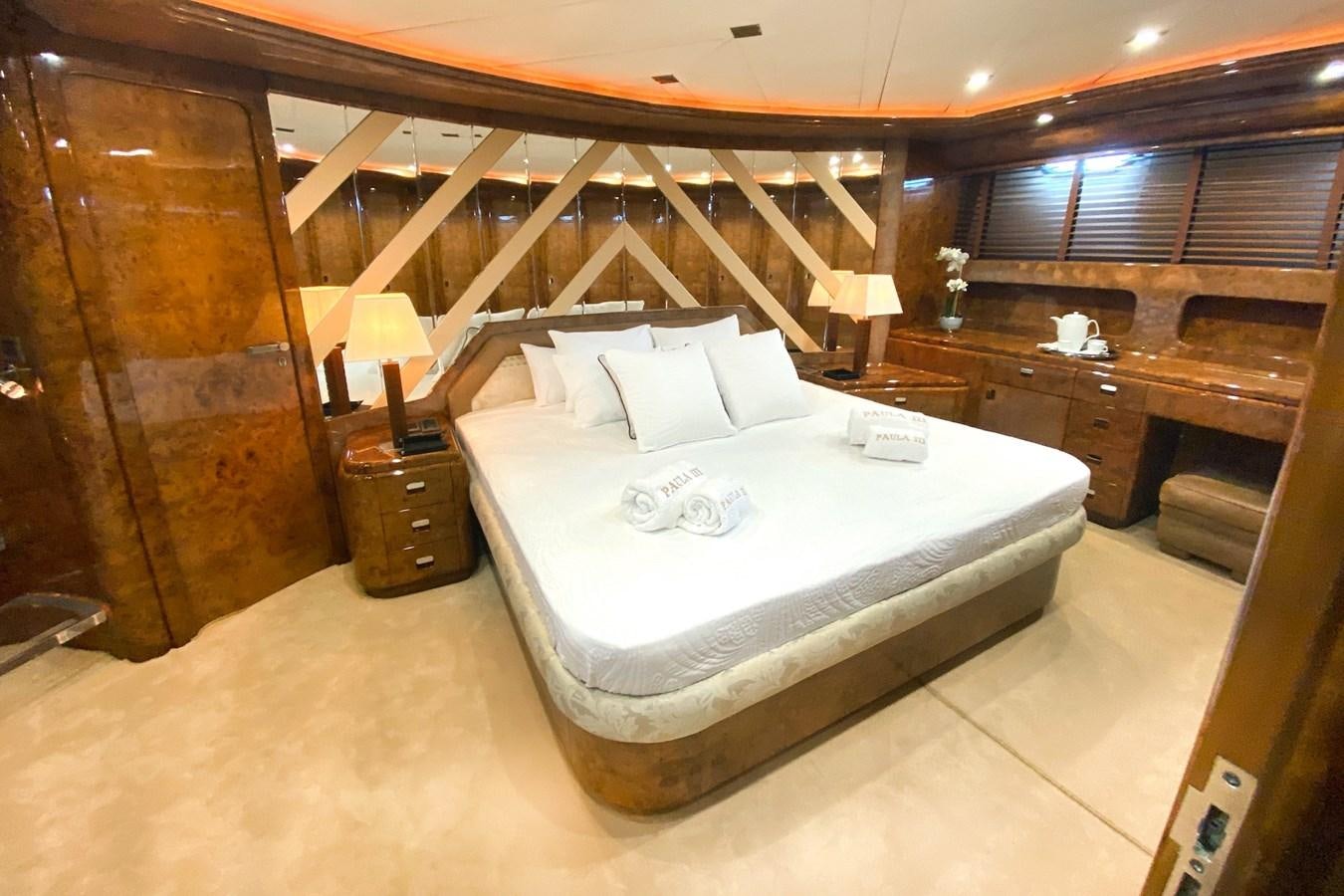 a bed in a room aboard PAULA III Yacht for Sale
