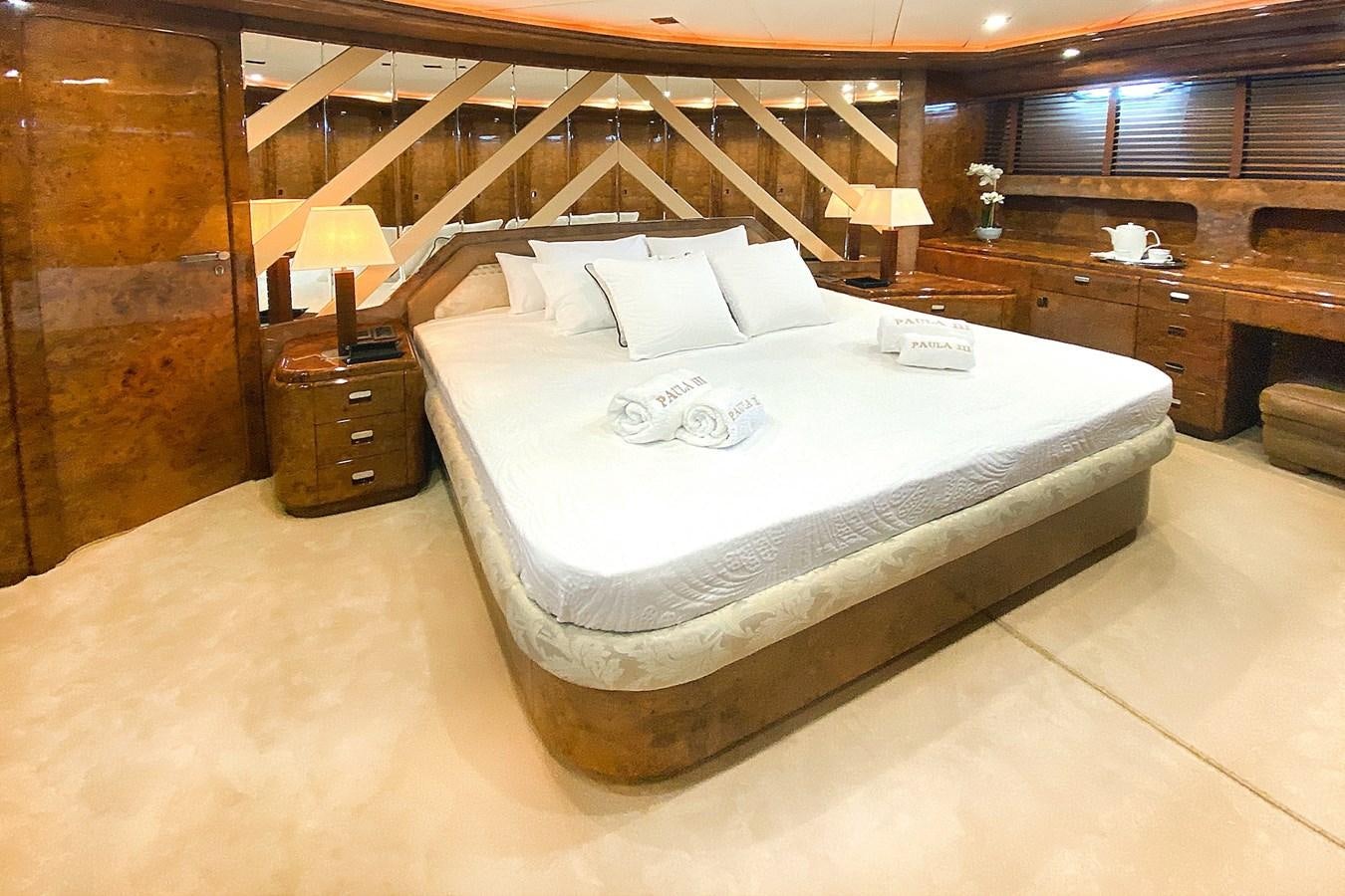 a bed in a room aboard PAULA III Yacht for Sale