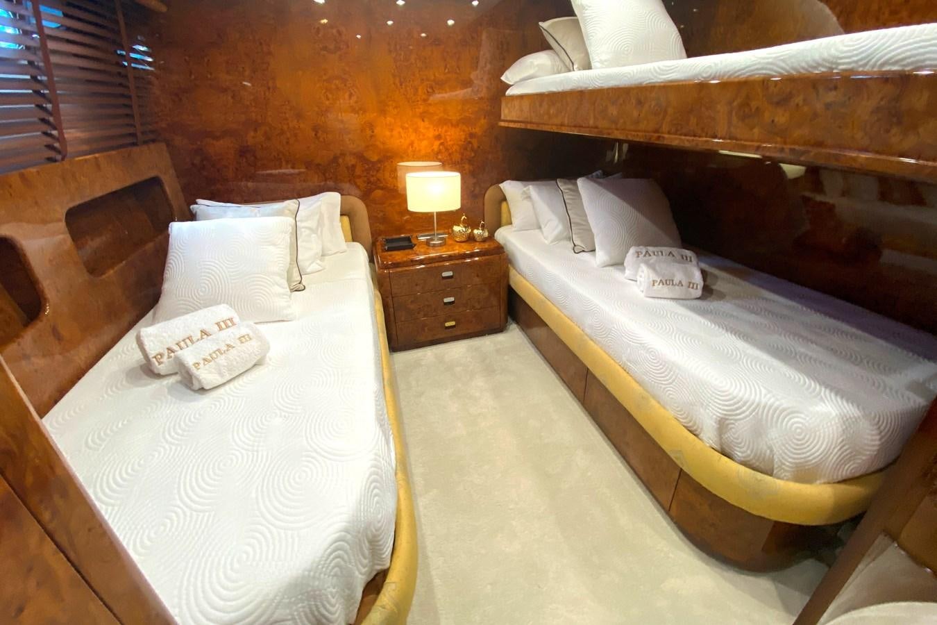 a room with two beds aboard PAULA III Yacht for Sale
