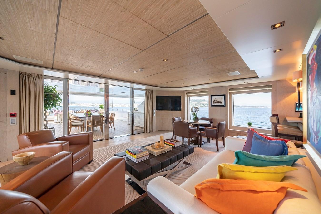 a living room with a large window aboard TIMBUKTU Yacht for Charter