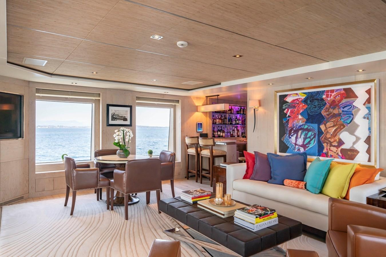 a living room with a couch and a table aboard TIMBUKTU Yacht for Charter