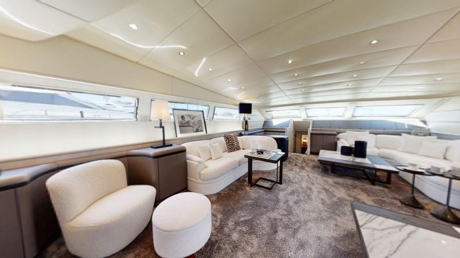 a room with a couch and a table and chairs aboard LAUREN V Yacht for Sale