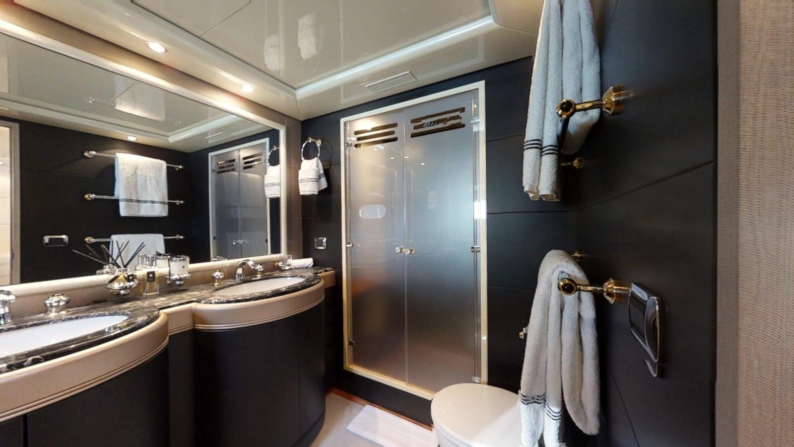 a bathroom with a sink and a mirror aboard LAUREN V Yacht for Sale