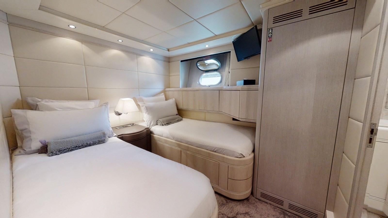a room with two beds aboard LAUREN V Yacht for Sale