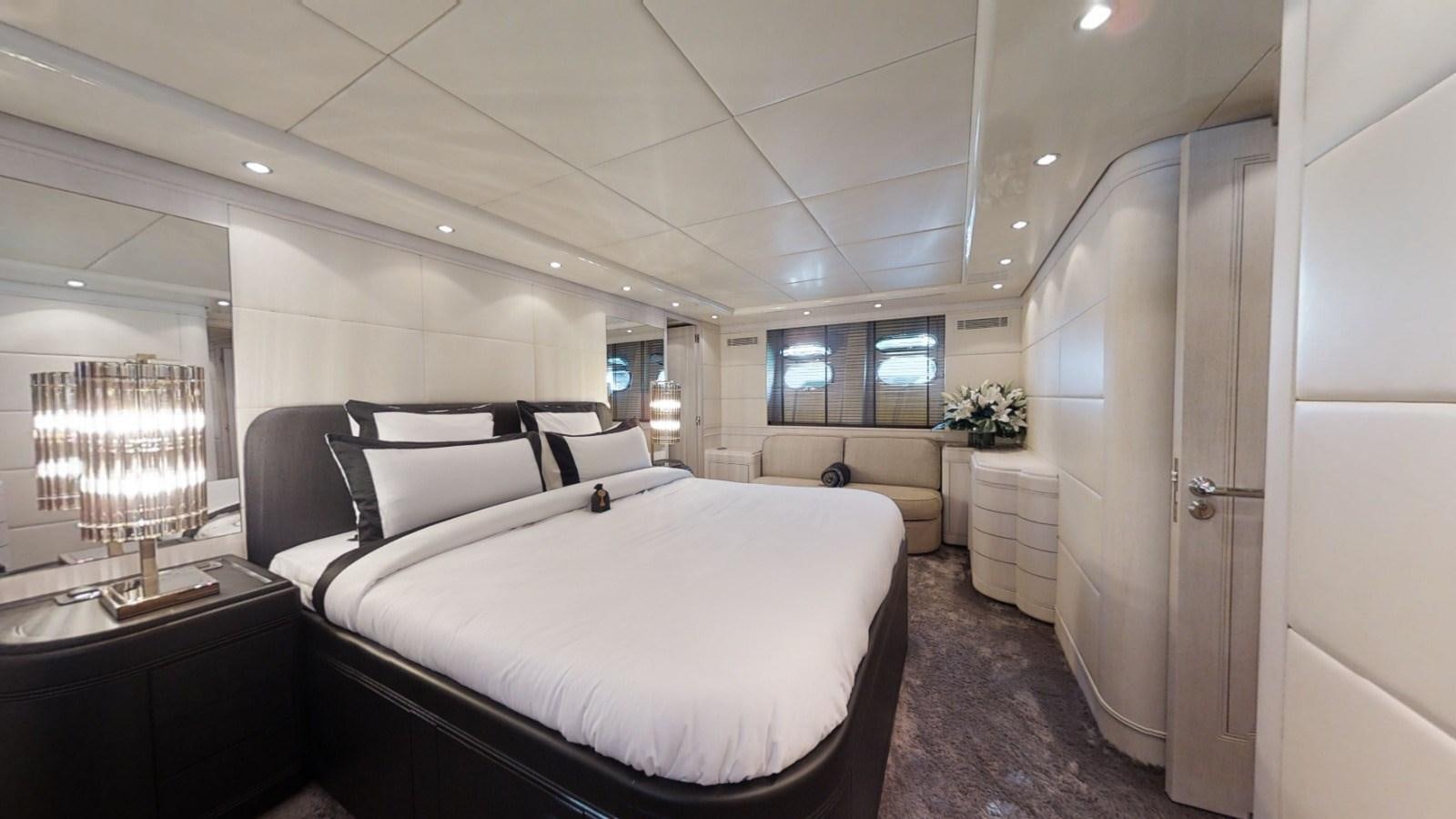 a large bedroom with a bed aboard LAUREN V Yacht for Sale